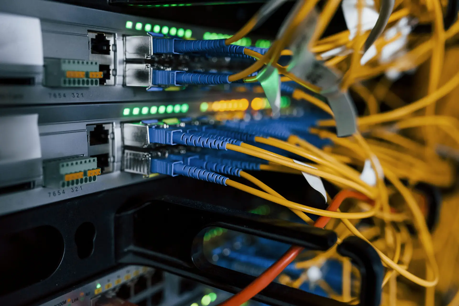 Close up view of internet equipment and cables in the server room.